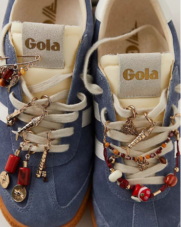 Light blue suede sneakers with beaded and decorated laces